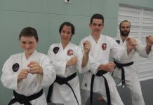 Four Combat black belts