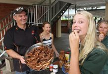 Students break bread together