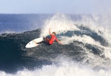 John John leads world title race