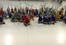 Tennis kids make a racquet