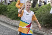 Baton passes to huge applause