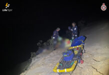 Paraglider rescued from sand cliff