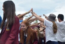 Noosa graduates run through a Guard of Honour tunnel