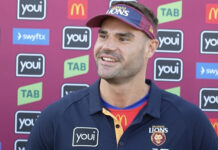 Brisbane Lions defender Jack Payne brings the cup home to Noosa
